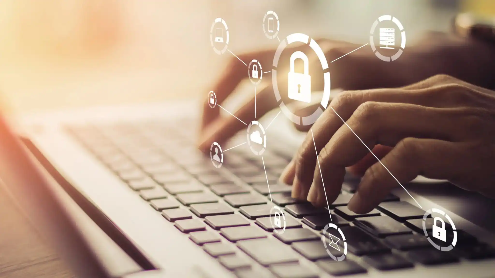 4129134-0-17442300-1771398130-Man-on-laptop-with-protective-security-locking-symbols