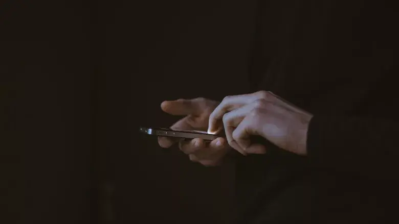 epub_Person-holding-phone-by-Gilles-Lambert_webp